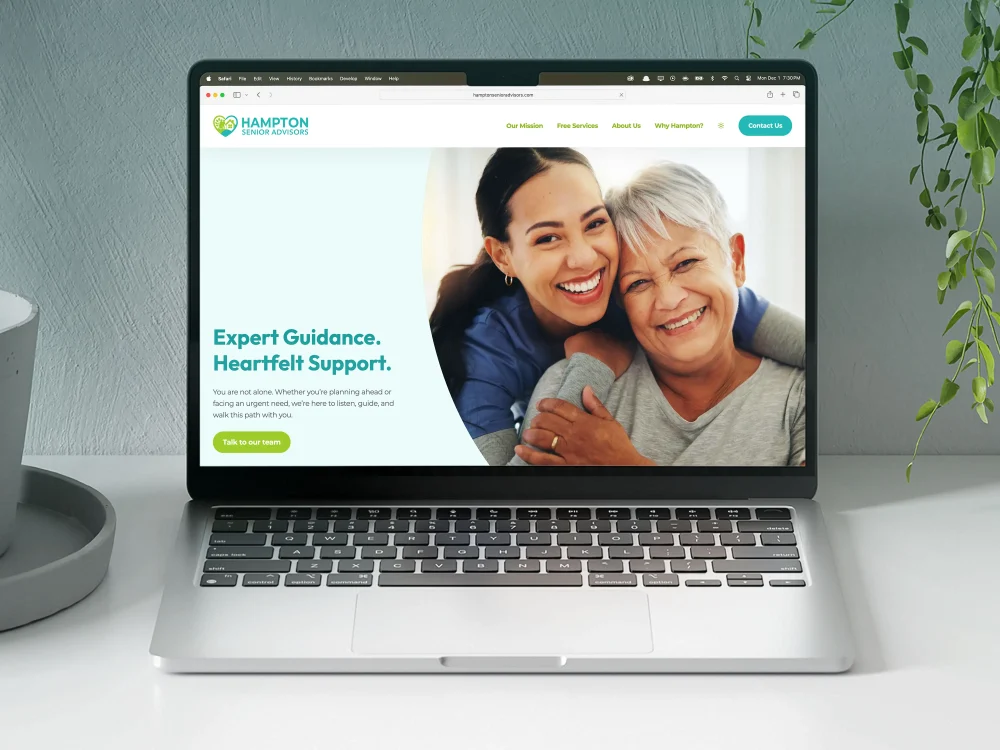 A laptop displaying the home page of the Hampton Senior Advisors website.